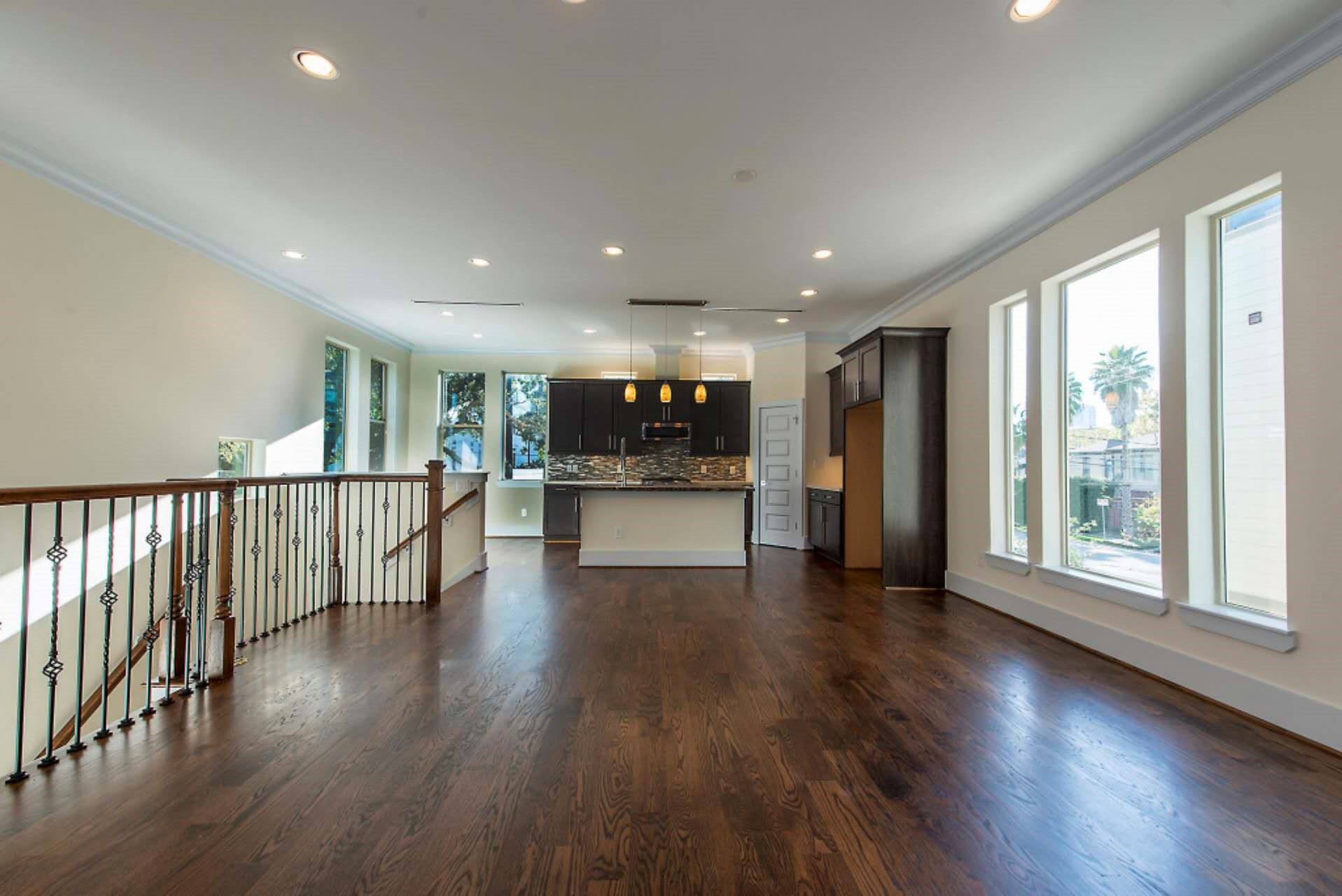 1805 Rosedale Street Houston, TX 77004 - Photo 19 of 27 a view of an empty room with wooden floor and windows