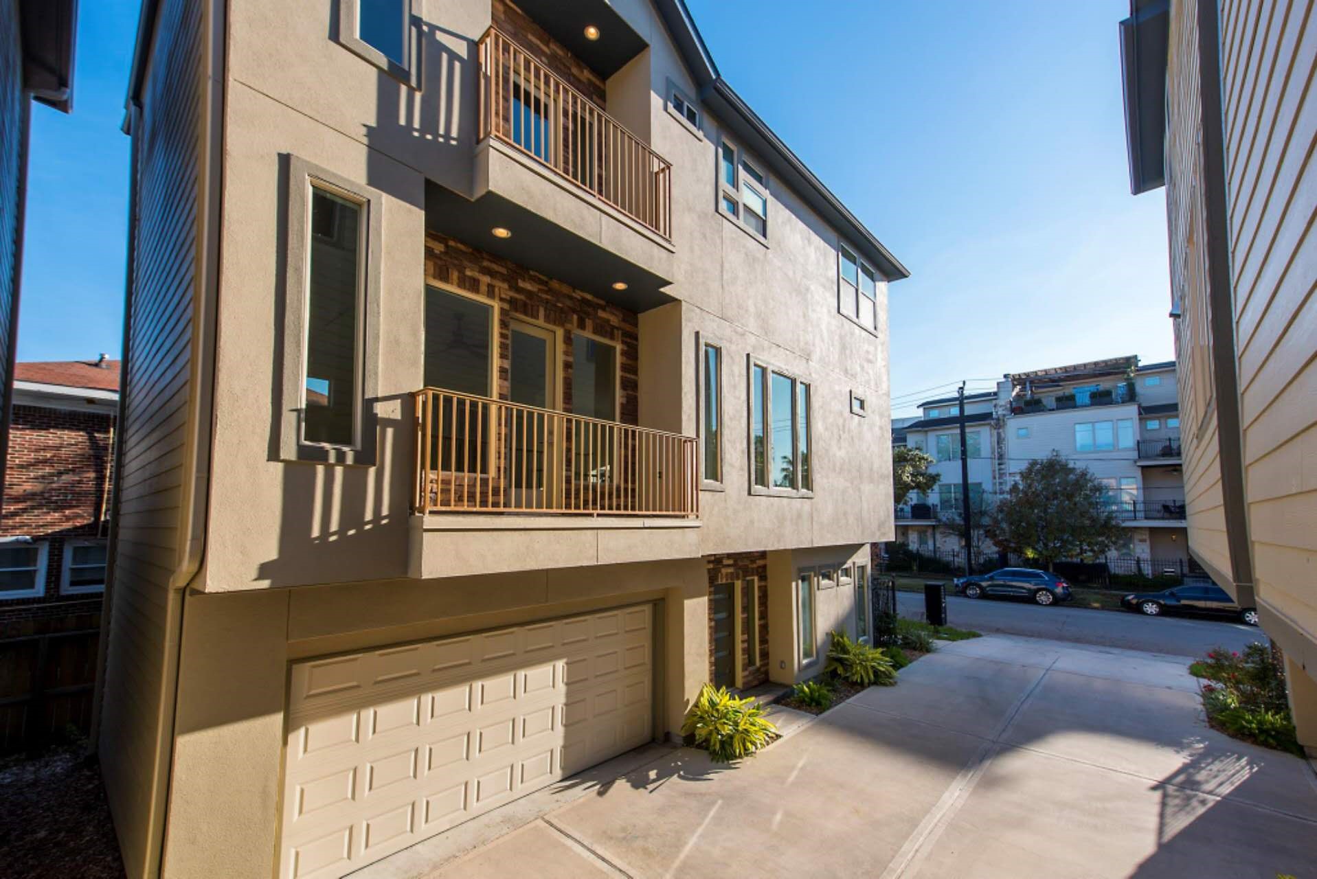 1805 Rosedale Street Houston, TX 77004 - Photo 2 of 27 a front view of a building with a yard