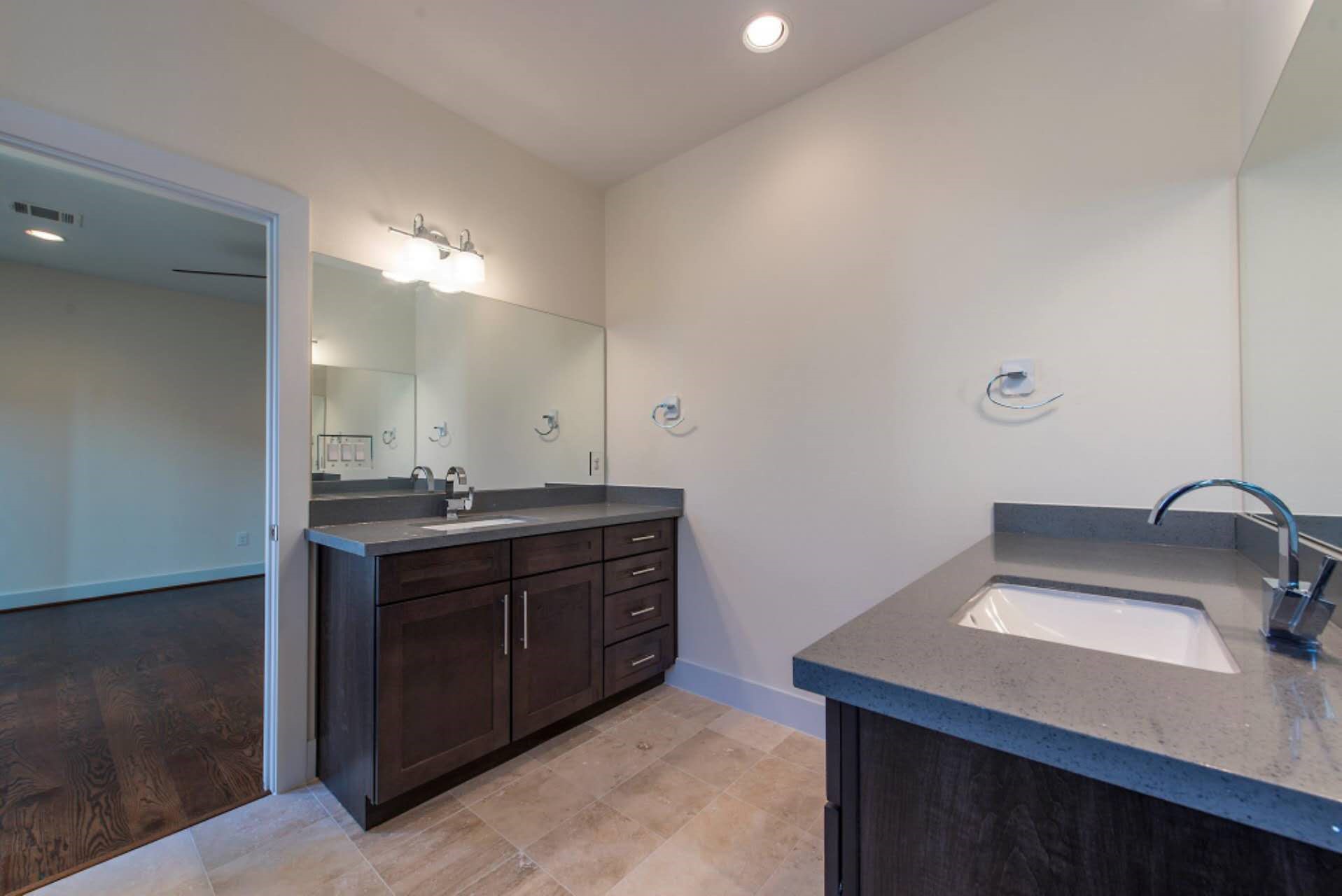 1805 Rosedale Street Houston, TX 77004 - Photo 24 of 27 a bathroom with a sink and a mirror