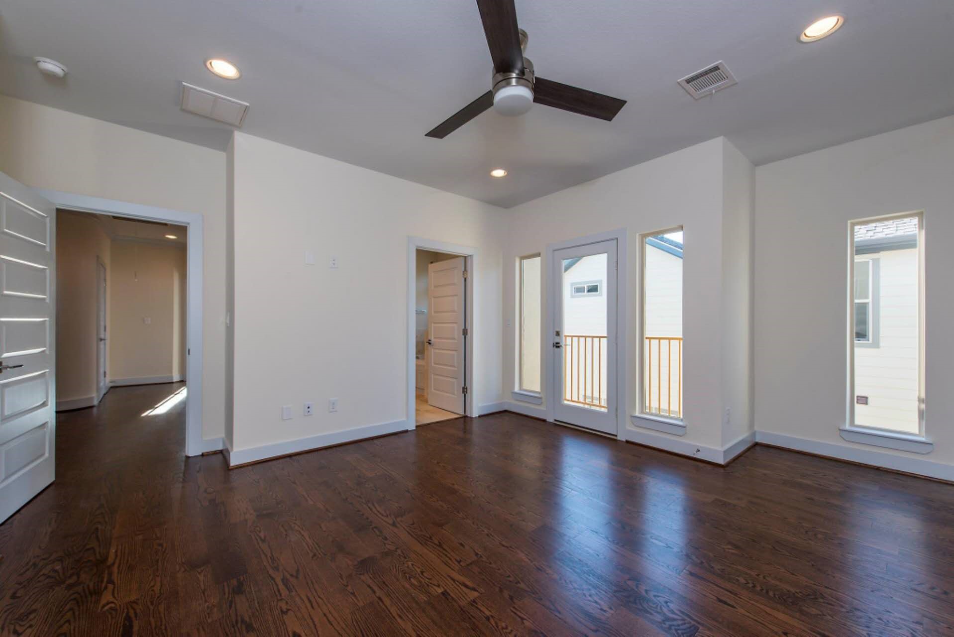 1805 Rosedale Street Houston, TX 77004 - Photo 26 of 27 a view of an empty room with wooden floor and a window