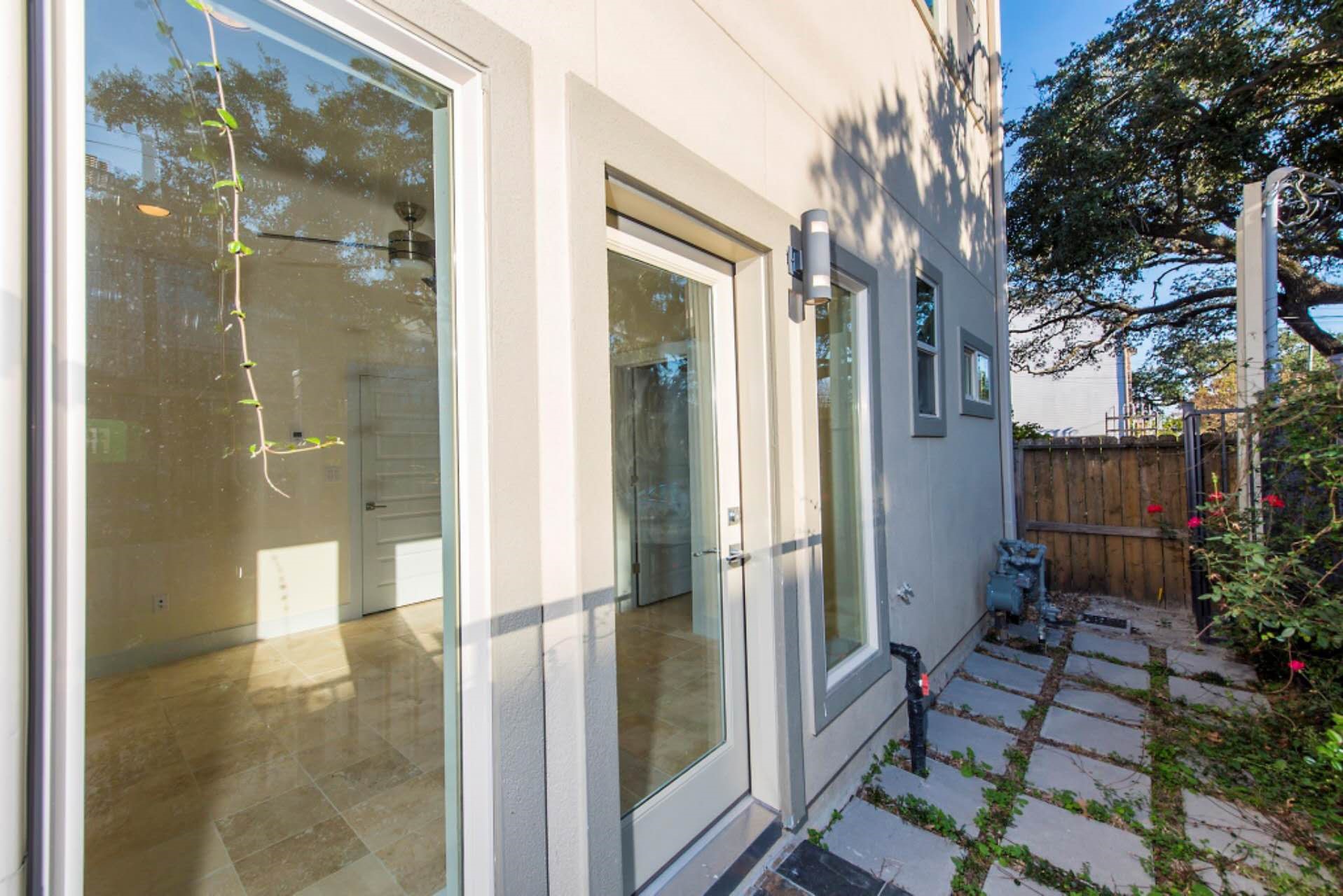 1805 Rosedale Street Houston, TX 77004 - Photo 9 of 27 a view of a bathroom with a glass door shower and a sink