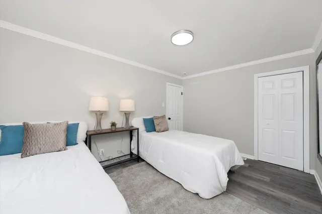 a bedroom with a bed and a lamp