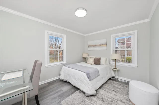 a bedroom with a bed and a chair