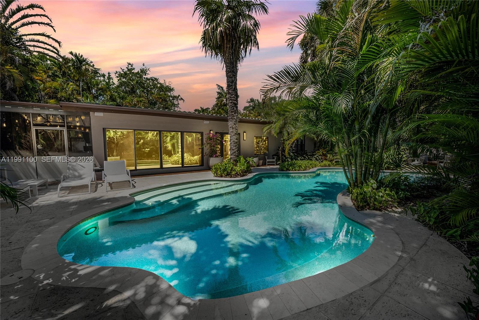 3620 Battersea Road Miami, FL 33133 - Photo 3 of 25 a view of a backyard with a garden