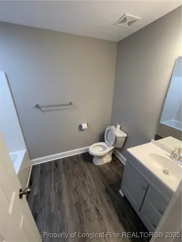 a bathroom with a sink and a toilet