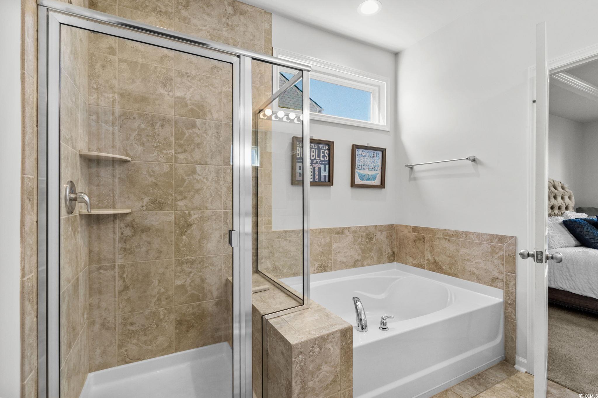 1663 Villena Drive Myrtle Beach, SC 29579 - Photo 19 of 40 Ensuite bathroom featuring a garden tub and a shower stall
