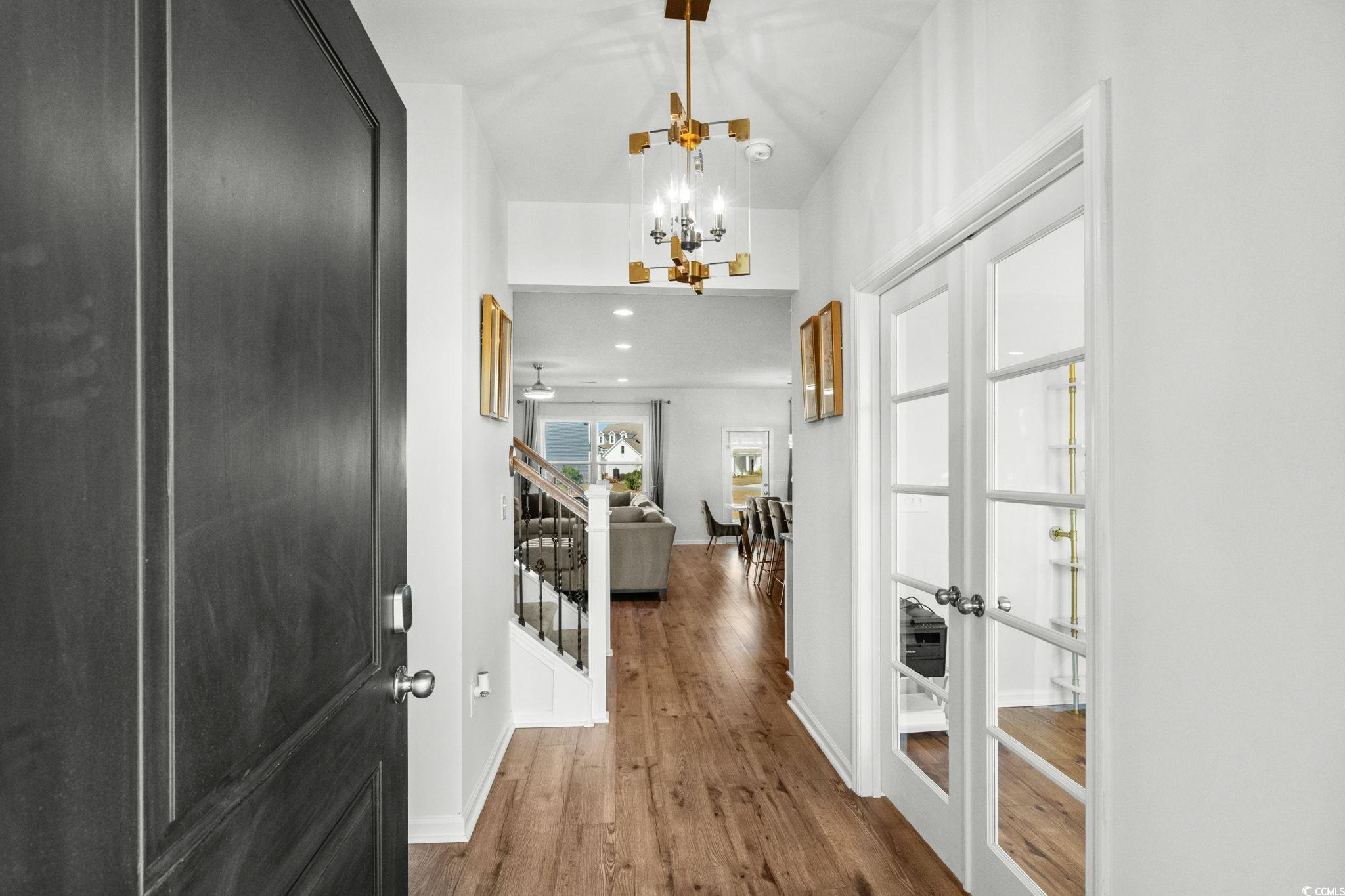 1663 Villena Drive Myrtle Beach, SC 29579 - Photo 2 of 40 Entrance foyer featuring dark wood-style flooring, a chandelier, stairway, and recessed lighting