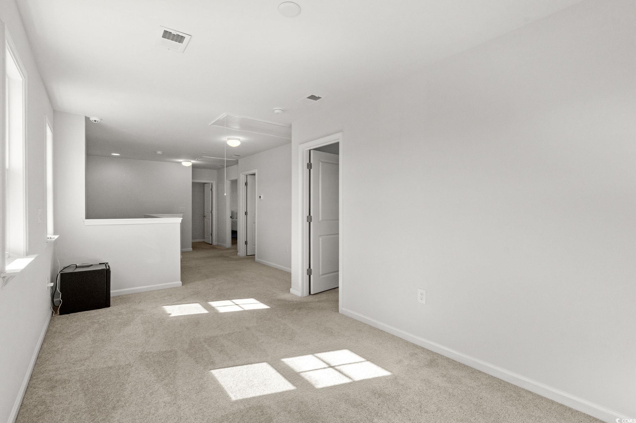 1663 Villena Drive Myrtle Beach, SC 29579 - Photo 22 of 40 Unfurnished room featuring attic access and light colored carpet