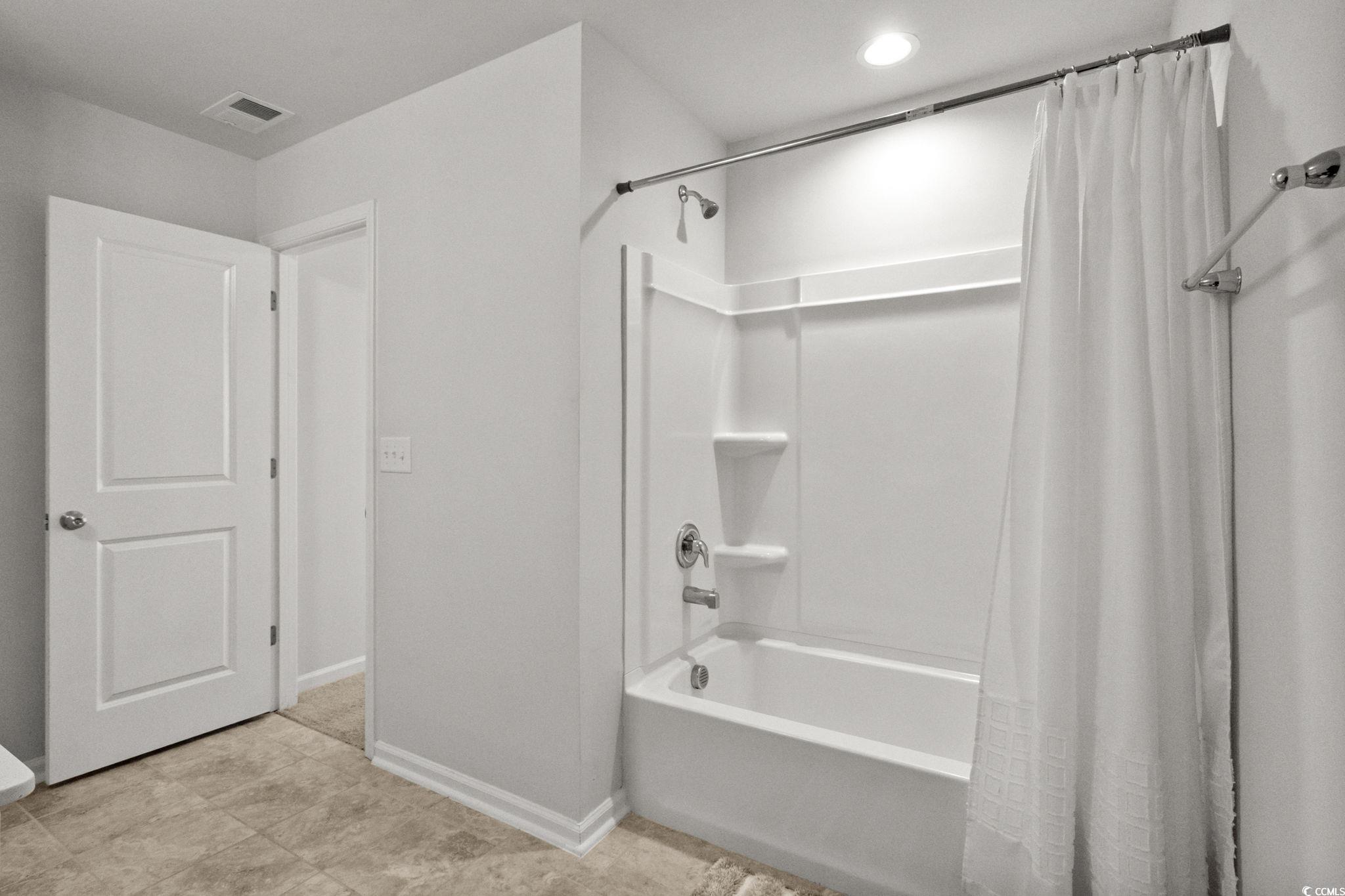 1663 Villena Drive Myrtle Beach, SC 29579 - Photo 27 of 40 Full bath with shower / bath combo with shower curtain and baseboards