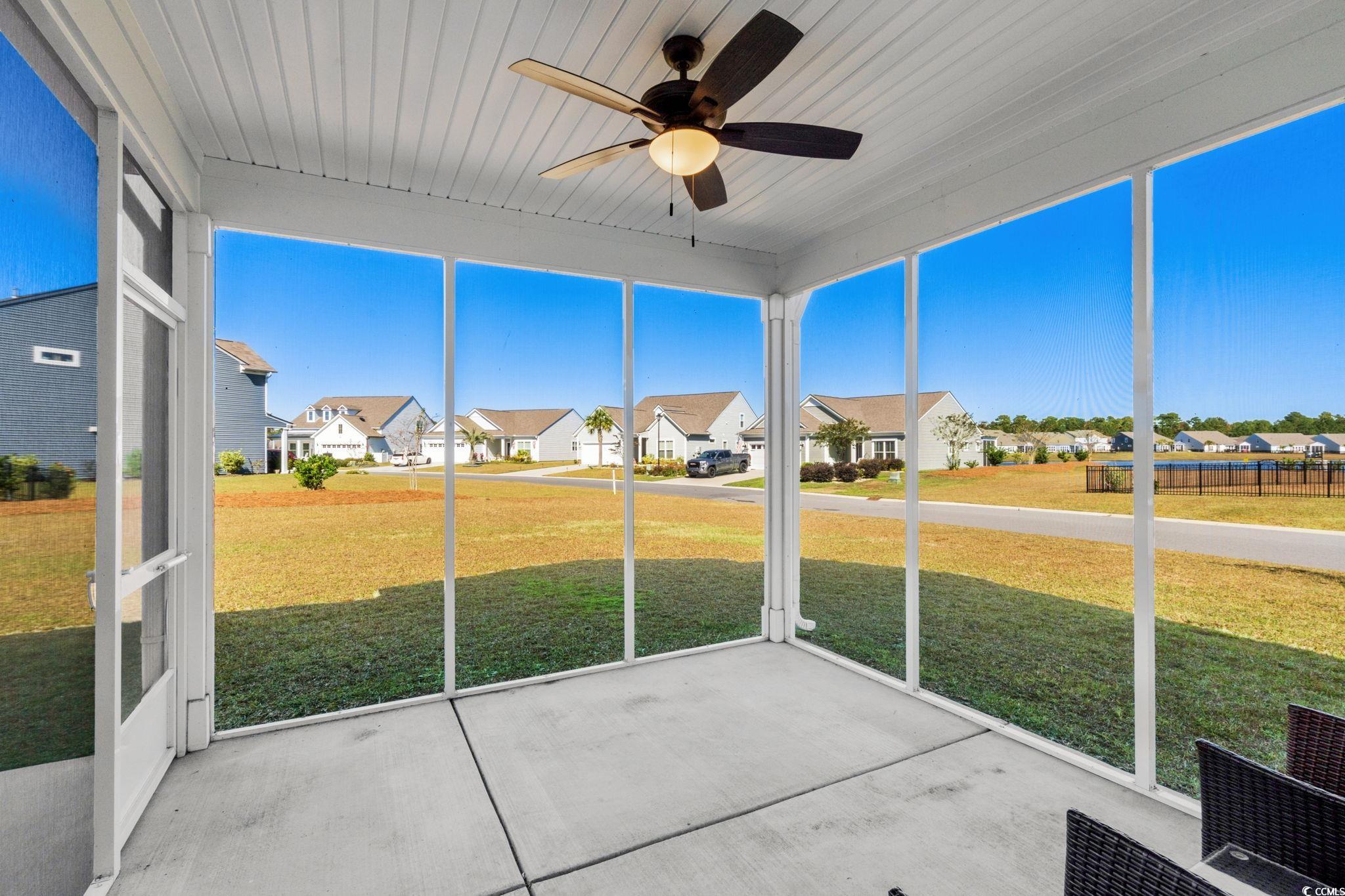 1663 Villena Drive Myrtle Beach, SC 29579 - Photo 30 of 40 Unfurnished sunroom featuring a ceiling fan and a residential view