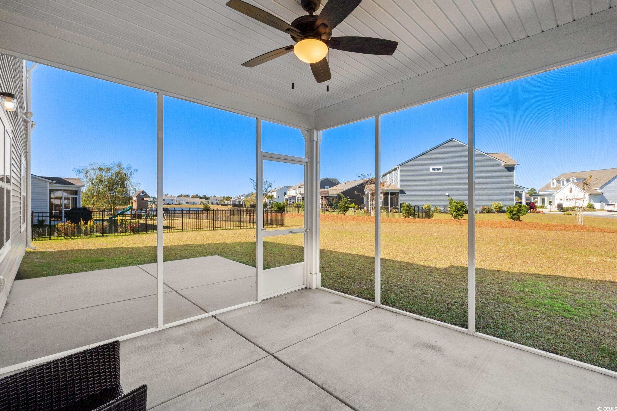 1663 Villena Drive Myrtle Beach, SC 29579 - Photo 31 of 40 Unfurnished sunroom with a residential view and a ceiling fan