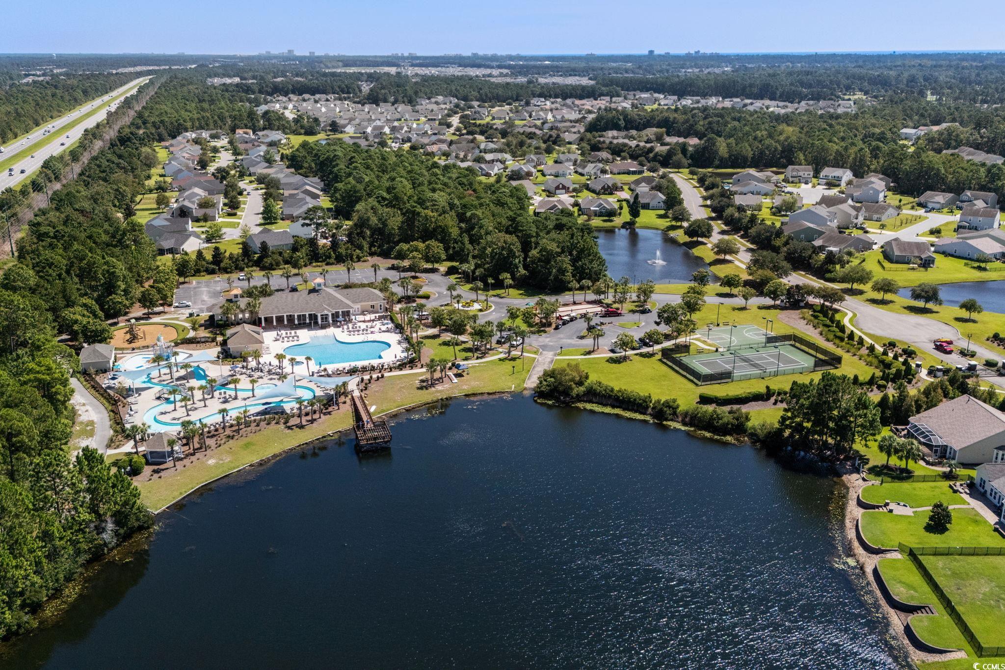 1663 Villena Drive Myrtle Beach, SC 29579 - Photo 39 of 40 Aerial perspective of suburban area featuring a large body of water and a pool