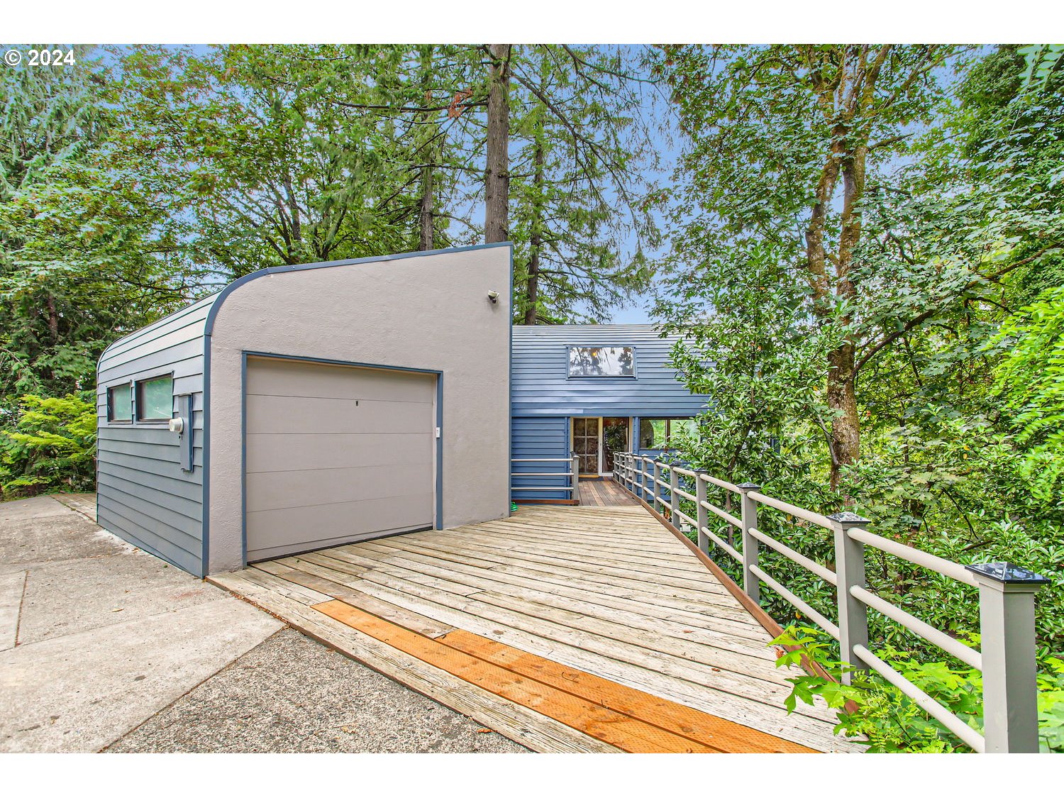 3831 Southwest Dosch Road Portland, OR 97239 - Photo 1 of 29 a front view of a house with a yard