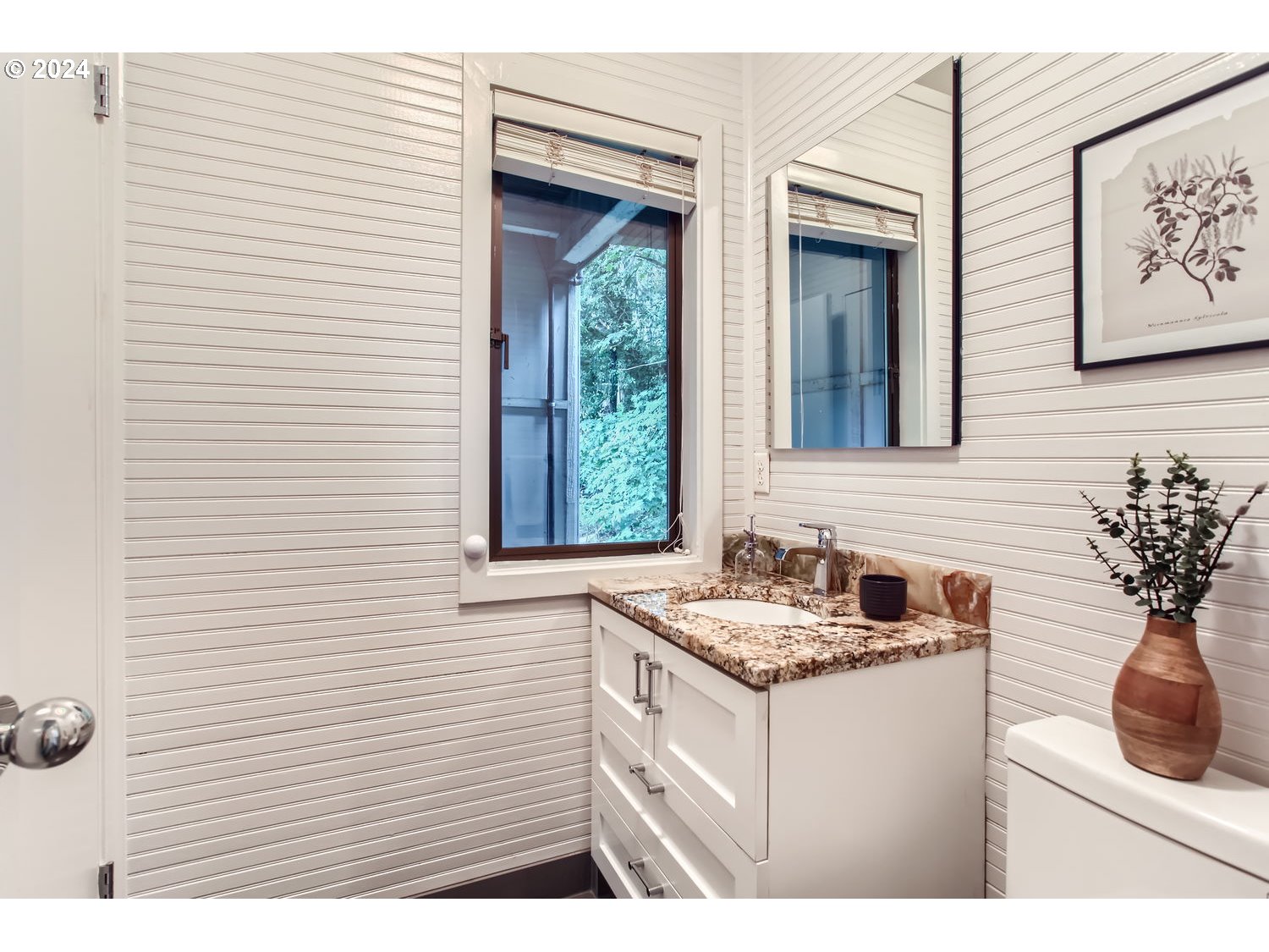 3831 Southwest Dosch Road Portland, OR 97239 - Photo 17 of 29 a bathroom with a sink and a mirror