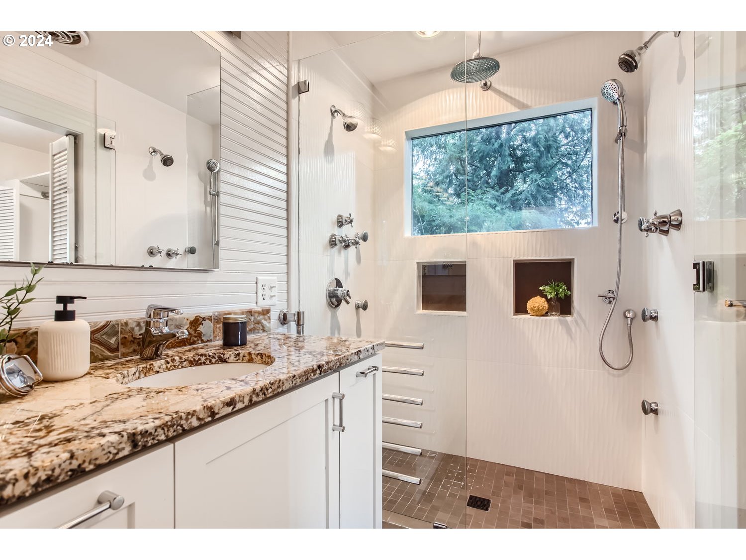 3831 Southwest Dosch Road Portland, OR 97239 - Photo 18 of 29 a bathroom with a granite countertop sink mirror and shower