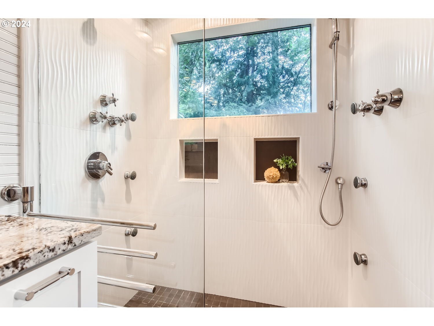 3831 Southwest Dosch Road Portland, OR 97239 - Photo 19 of 29 a bathroom with a granite countertop sink a mirror and shower