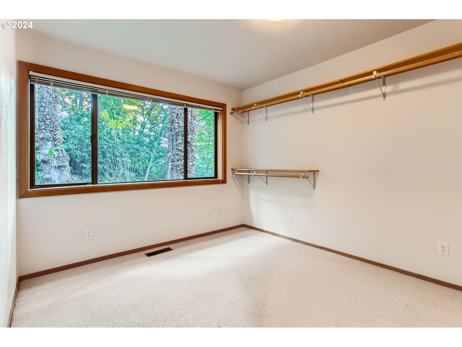 3831 Southwest Dosch Road Portland, OR 97239 - Photo 20 of 29 a view of an empty room with a window
