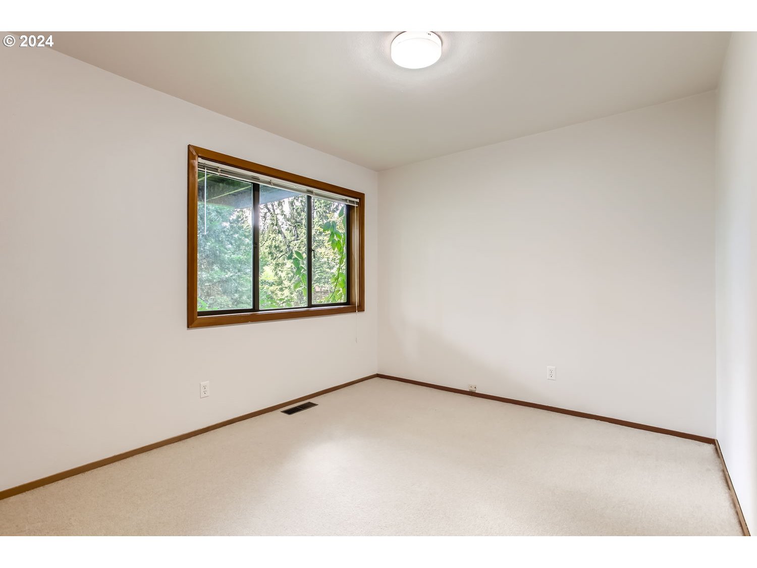 3831 Southwest Dosch Road Portland, OR 97239 - Photo 22 of 29 a view of an empty room with a window