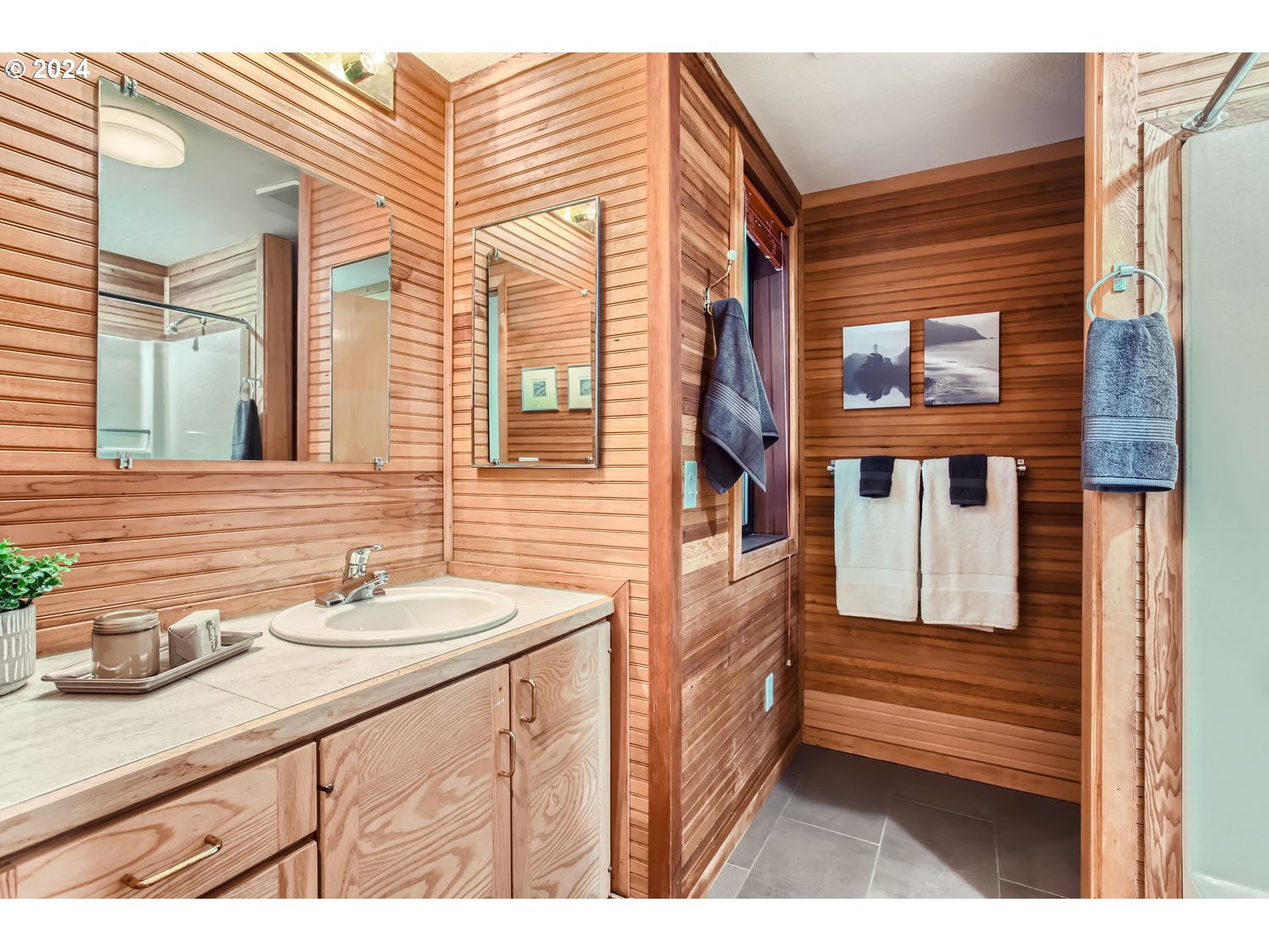 3831 Southwest Dosch Road Portland, OR 97239 - Photo 23 of 29 a bathroom with a sink and a mirror