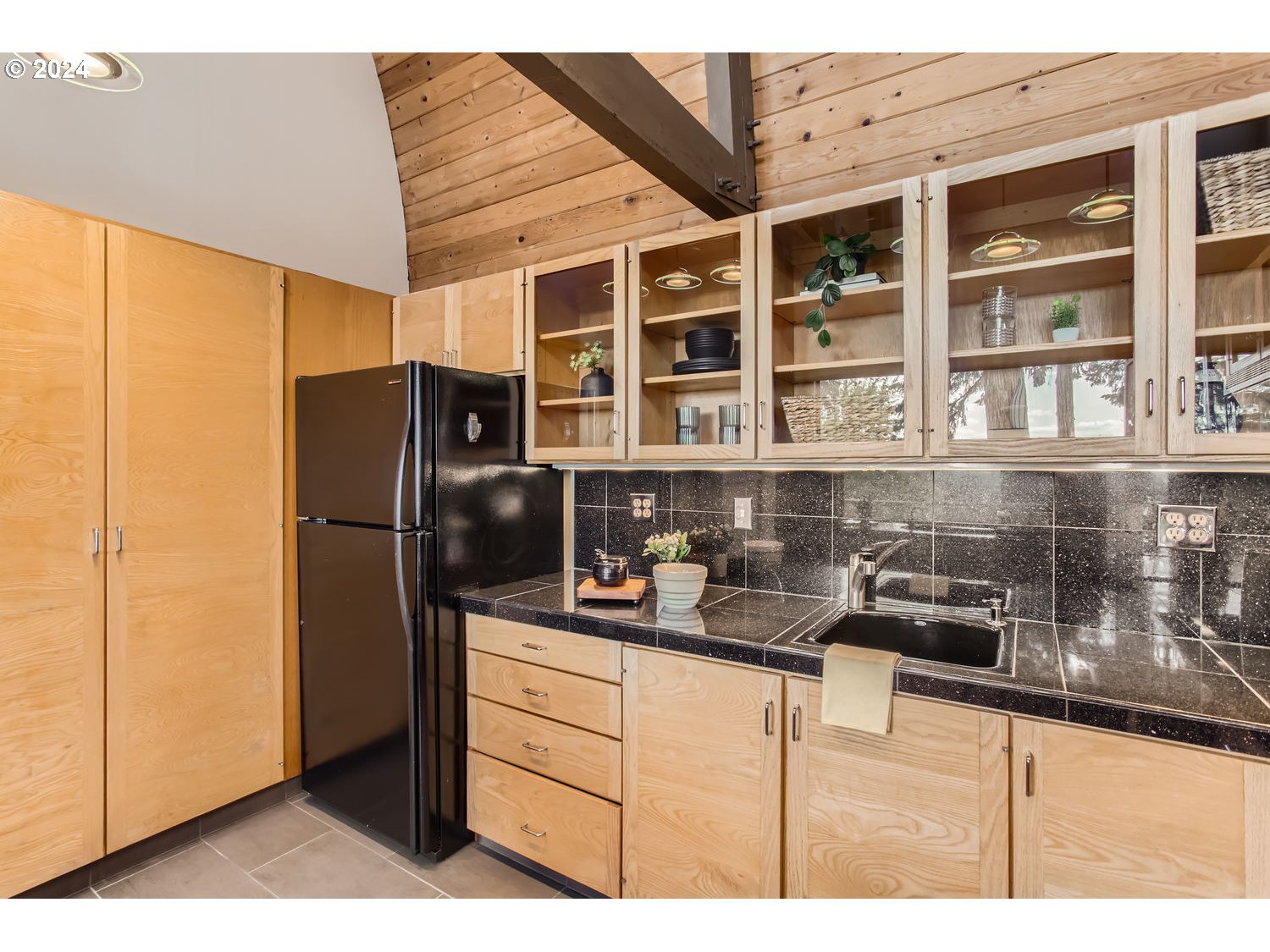 3831 Southwest Dosch Road Portland, OR 97239 - Photo 10 of 29 a kitchen with stainless steel appliances granite countertop a refrigerator and a sink