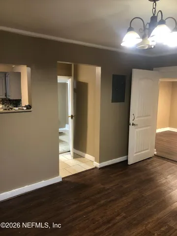 a view of a livingroom with wooden floor