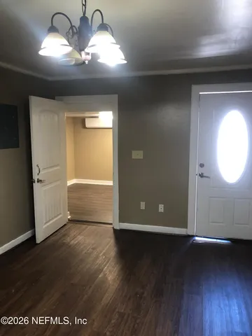 a view of a livingroom with wooden floor