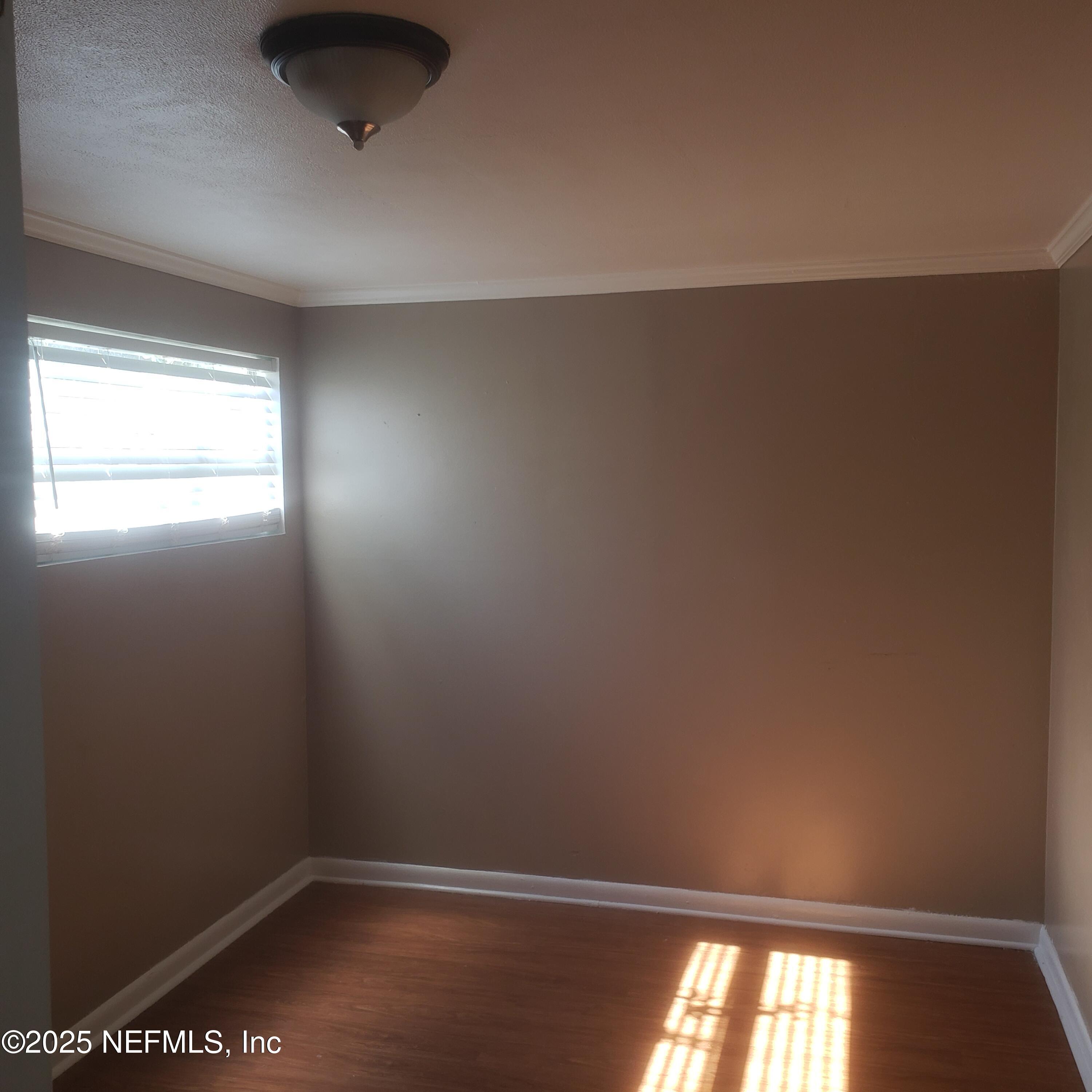 3034 Post Street Jacksonville, FL 32205 - Photo 6 of 12 an empty room with a window
