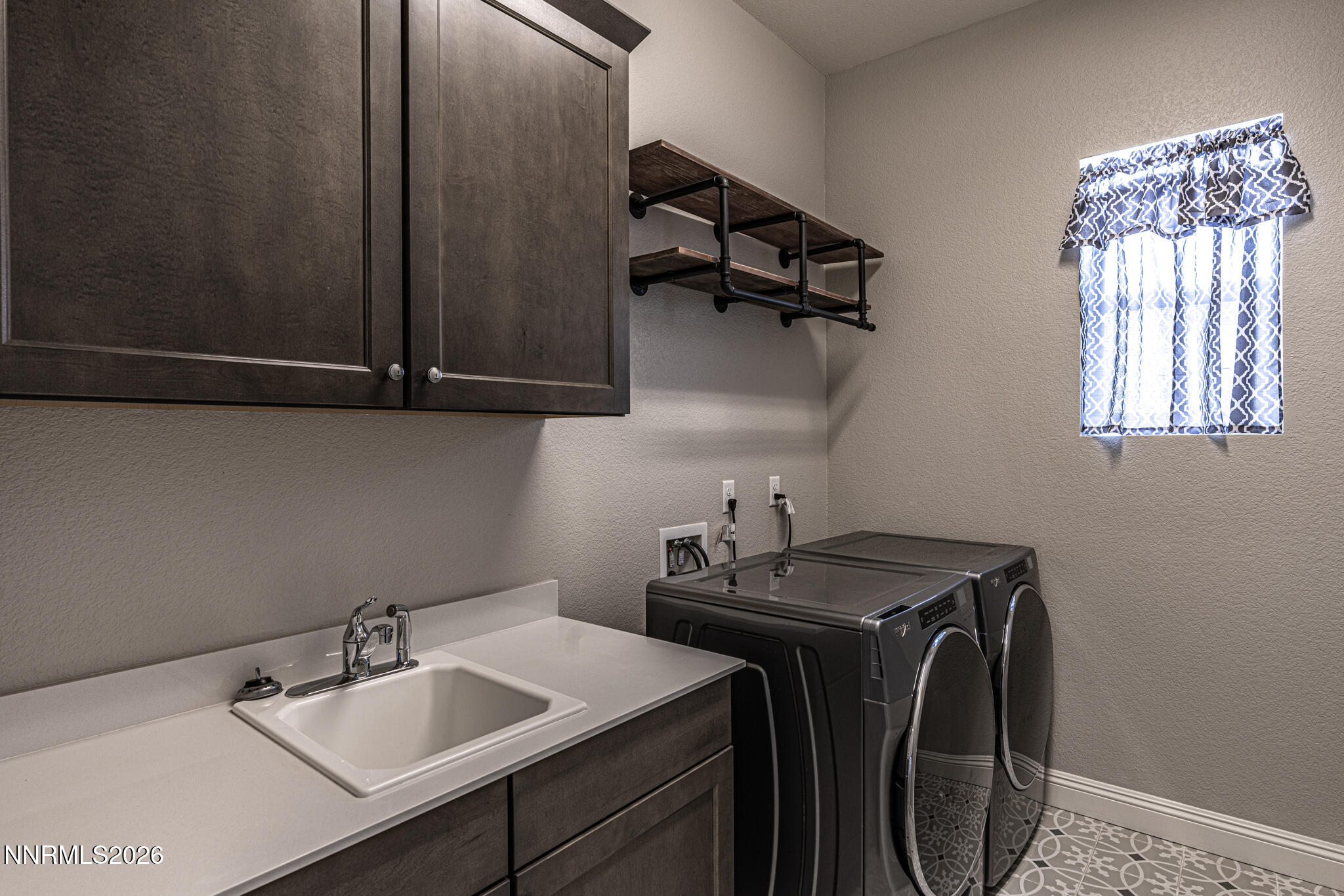 2109 Cast Iron Drive Reno, NV 89521 - Photo 9 of 35 a utility room with sink dryer and washer