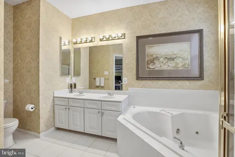 a bathroom with a bathtub a sink and a toilet