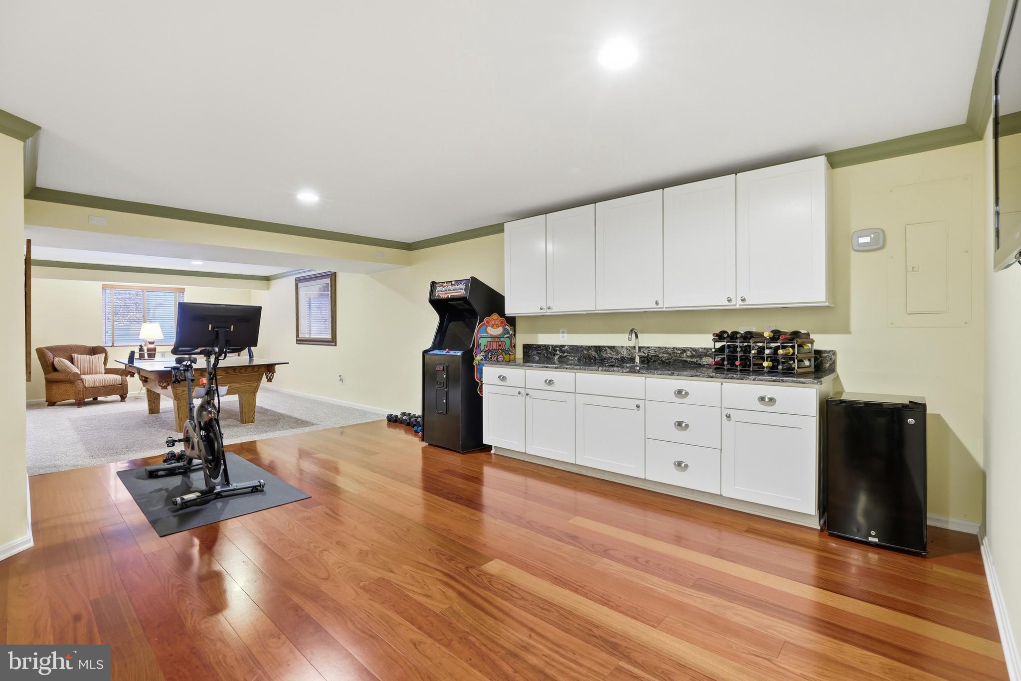 1612 Trawler Lane Annapolis, MD 21409 - Photo 32 of 48 a kitchen with a refrigerator and white cabinets