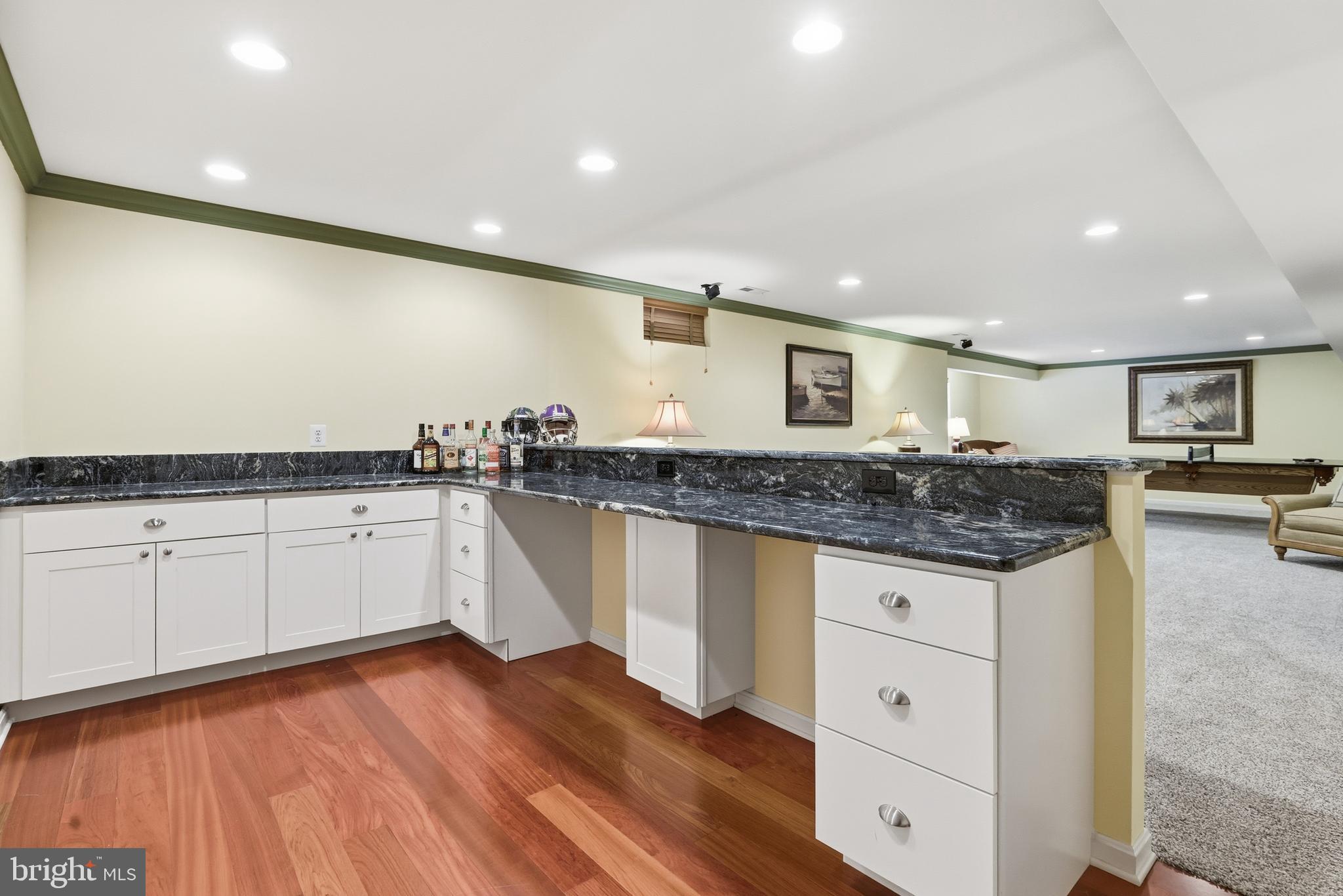 1612 Trawler Lane Annapolis, MD 21409 - Photo 37 of 48 a kitchen with granite countertop a sink and cabinets
