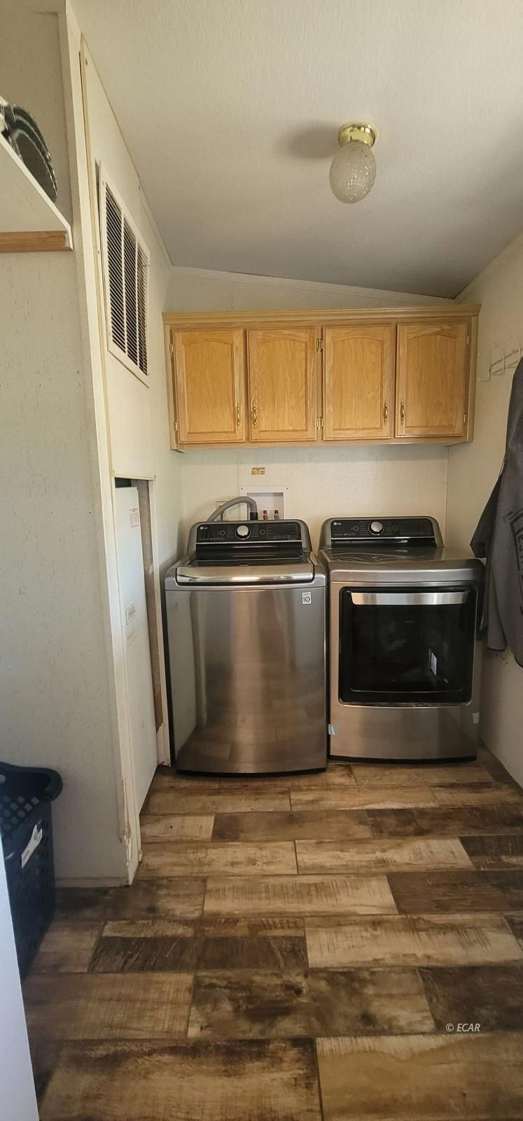 933 Spring Valley Parkway Spring Creek, NV 89815 - Photo 26 of 27 a kitchen with stainless steel appliances granite countertop a stove and a refrigerator