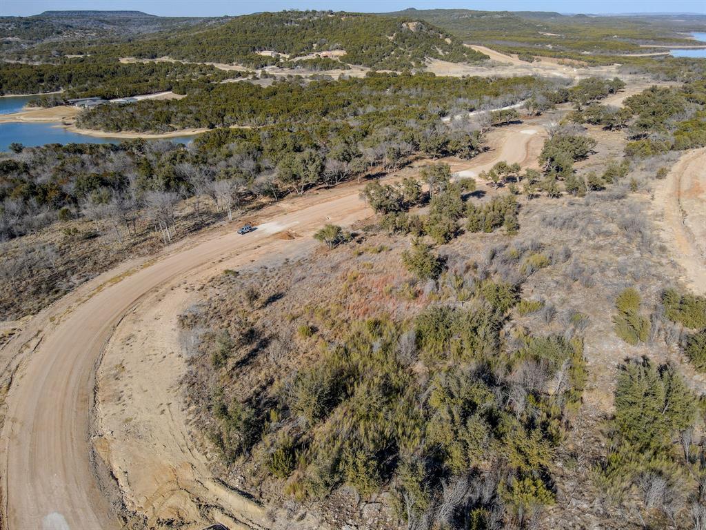 Lot 112 Clearwater Point Graham, TX 76450 - Photo 5 of 13 an aerial view of a house with a mountain