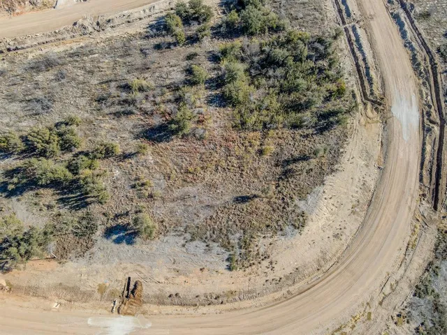 a view of a lake with houses in the back