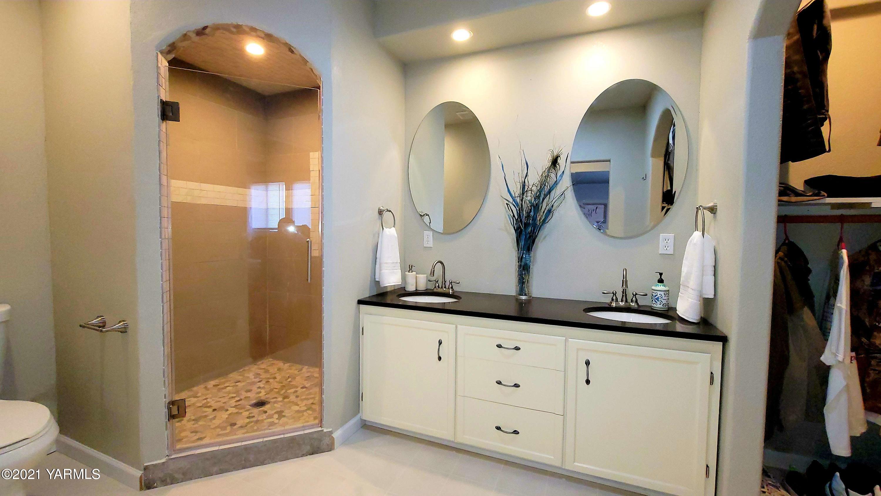 1141 Alexander Road Sunnyside, WA 98944 - Photo 11 of 16 a bathroom with double vanity sink and a mirror