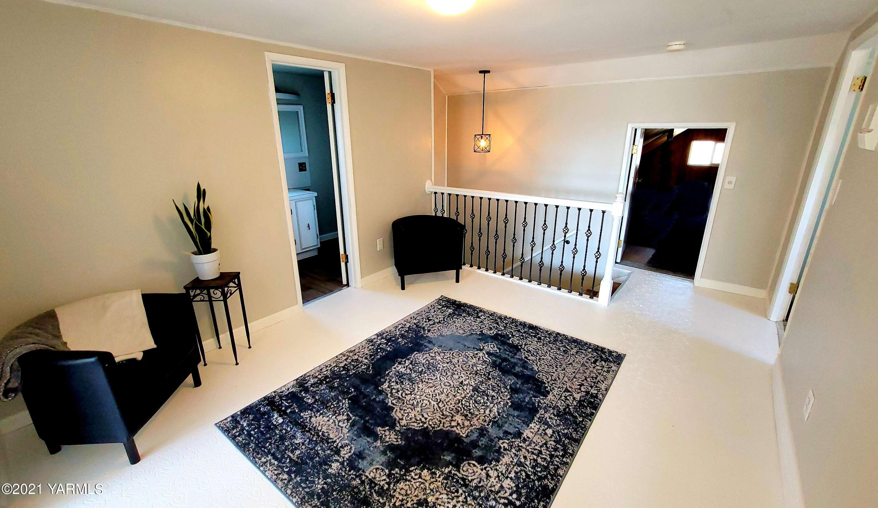 1141 Alexander Road Sunnyside, WA 98944 - Photo 15 of 16 a view of a livingroom with furniture and wooden floor
