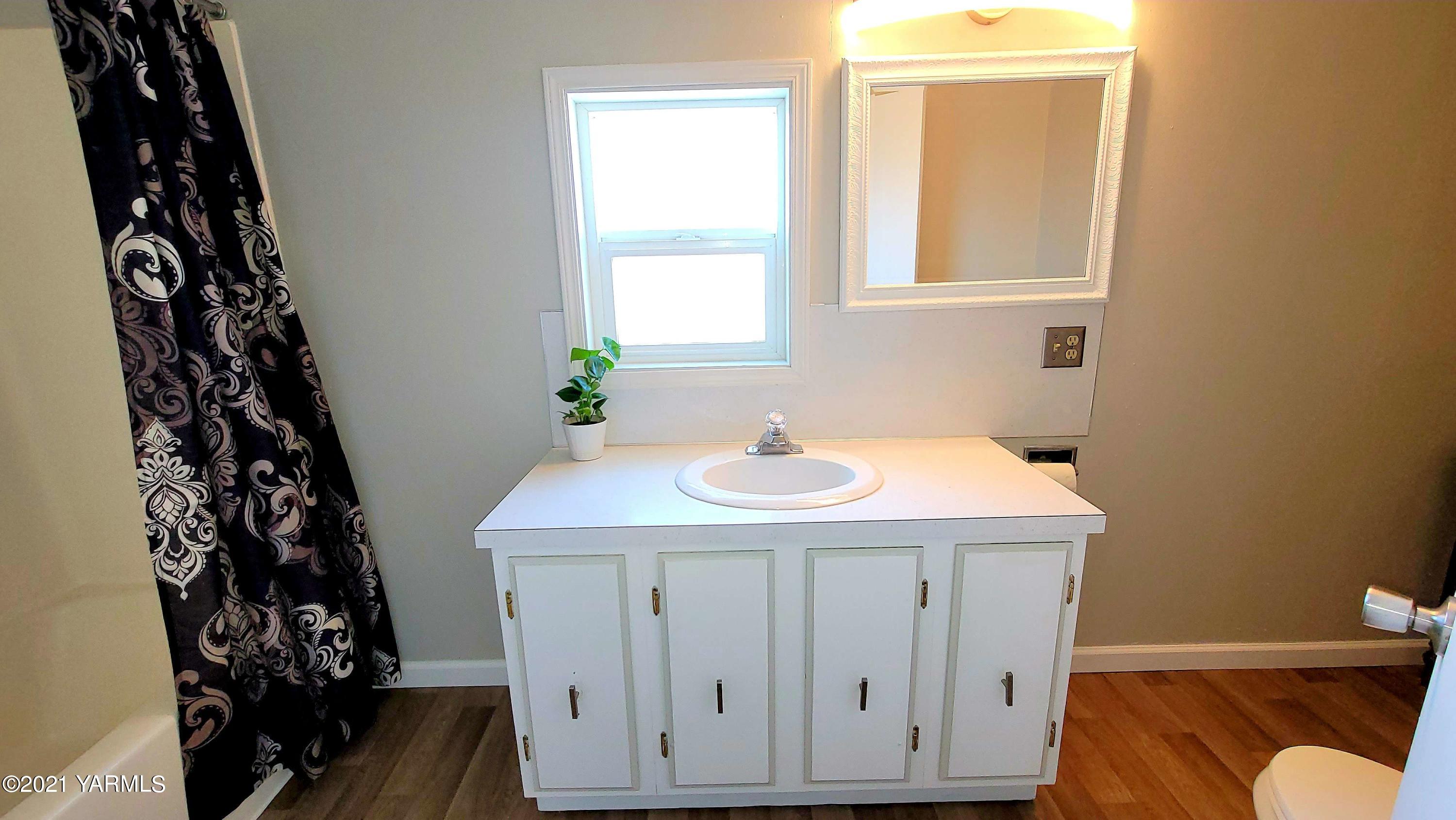 1141 Alexander Road Sunnyside, WA 98944 - Photo 16 of 16 a bathroom with a sink and a toilet