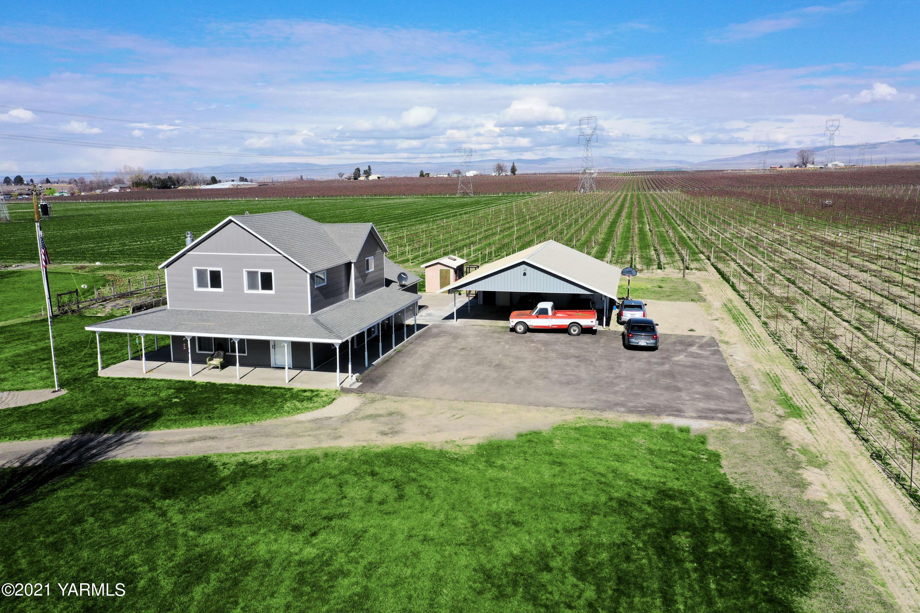 1141 Alexander Road Sunnyside, WA 98944 - Photo 3 of 16 a aerial view of a house with a yard