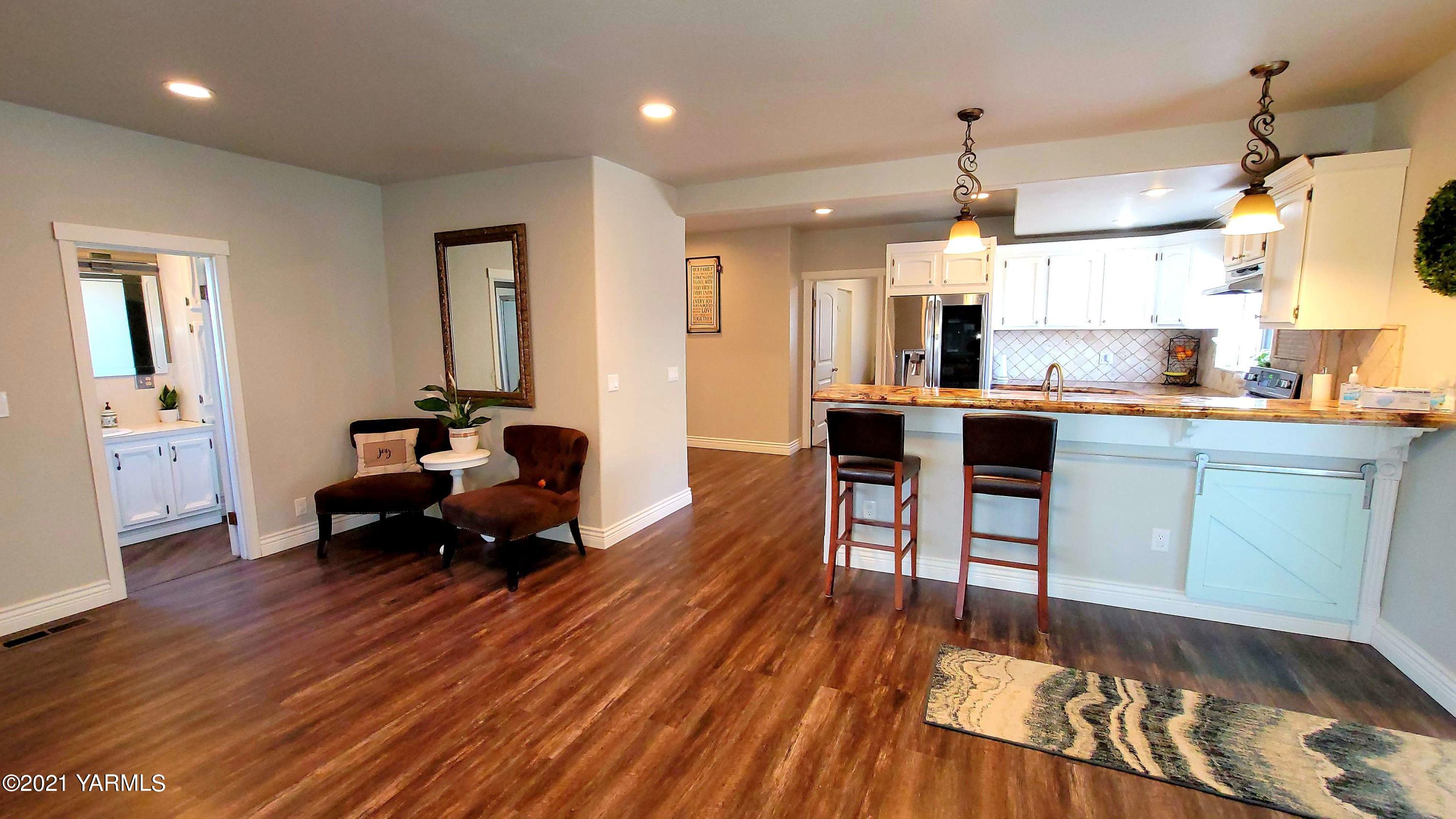 1141 Alexander Road Sunnyside, WA 98944 - Photo 8 of 16 a living room with furniture and a wooden floor