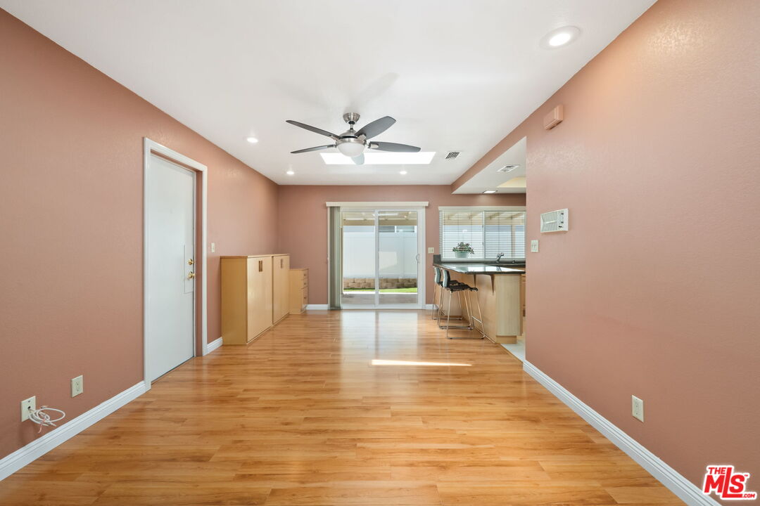 1463 Morrow Circle Thousand Oaks, CA 91362 - Photo 12 of 25 a view of a living room with wooden floor and a ceiling fan