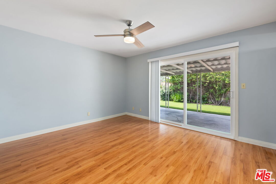 1463 Morrow Circle Thousand Oaks, CA 91362 - Photo 14 of 25 a view of an empty room with wooden floor and a window