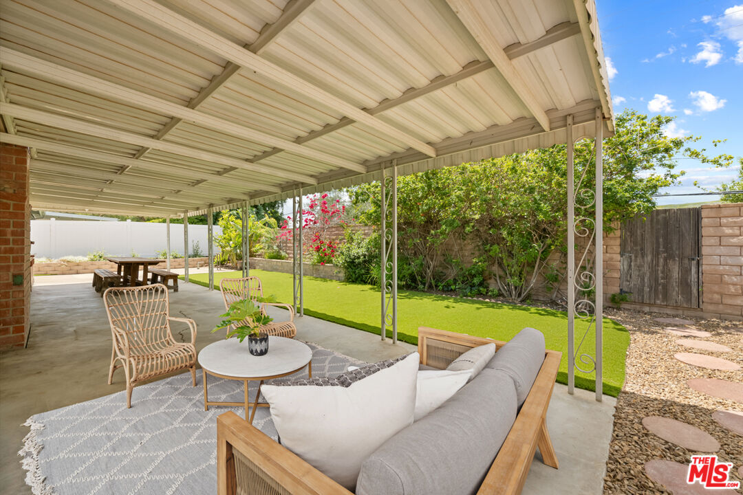 1463 Morrow Circle Thousand Oaks, CA 91362 - Photo 25 of 25 a view of a patio with a table chairs and a small yard