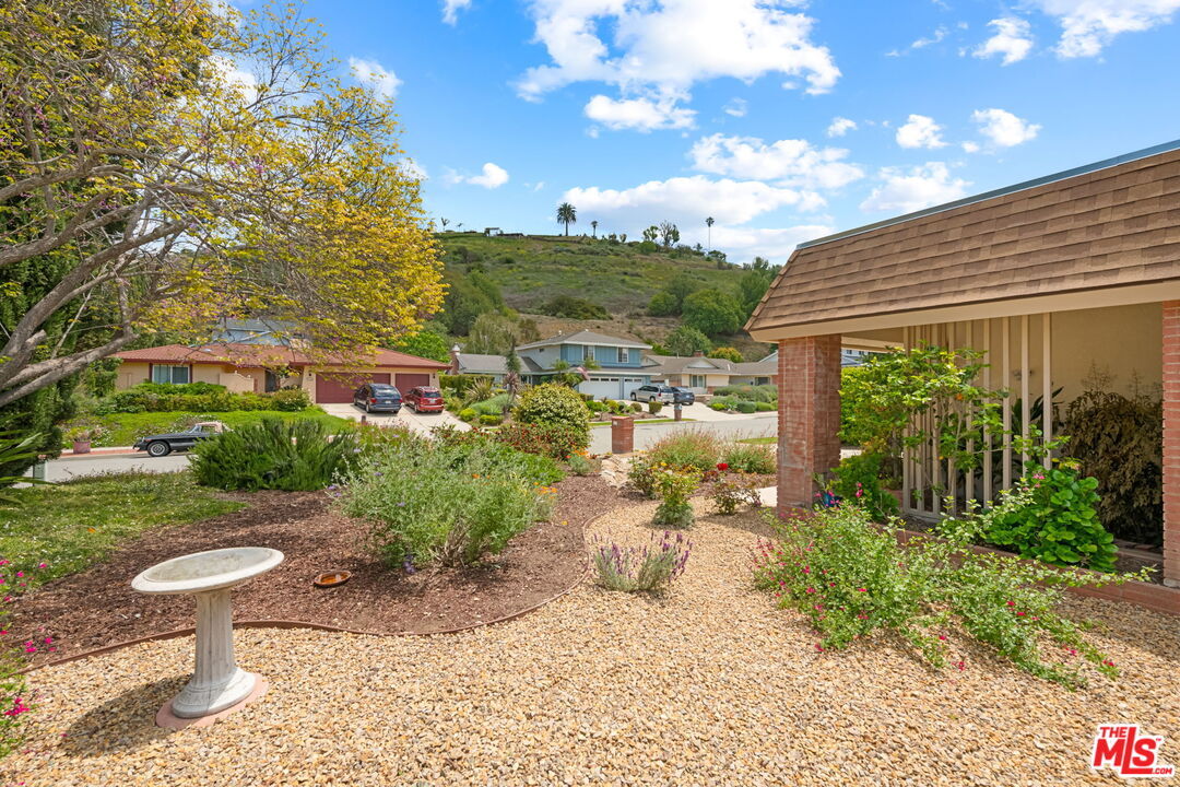 1463 Morrow Circle Thousand Oaks, CA 91362 - Photo 3 of 25 a view of a backyard with plants and a garden