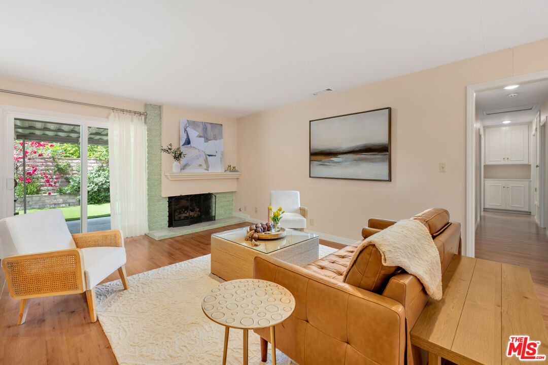1463 Morrow Circle Thousand Oaks, CA 91362 - Photo 6 of 25 a living room with furniture a fireplace and a large window