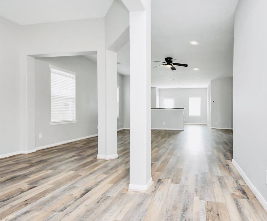 20414 Friesian Trail Humble, TX 77338 - Photo 2 of 6 a view of a room with wooden floor and a bathroom