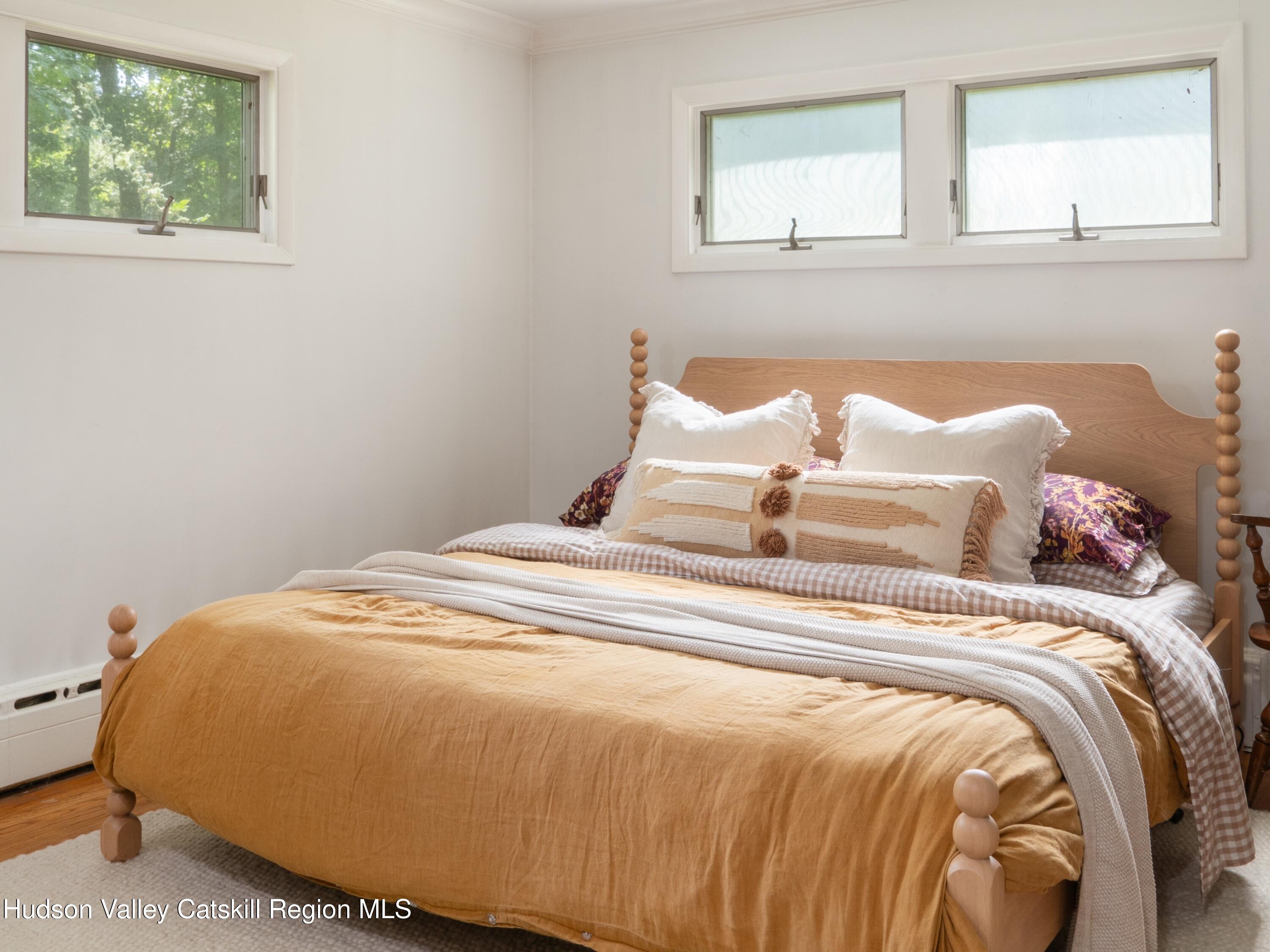 1002 Cairo Junction Road Catskill, NY 12414 - Photo 11 of 20 a bedroom with a bed and window