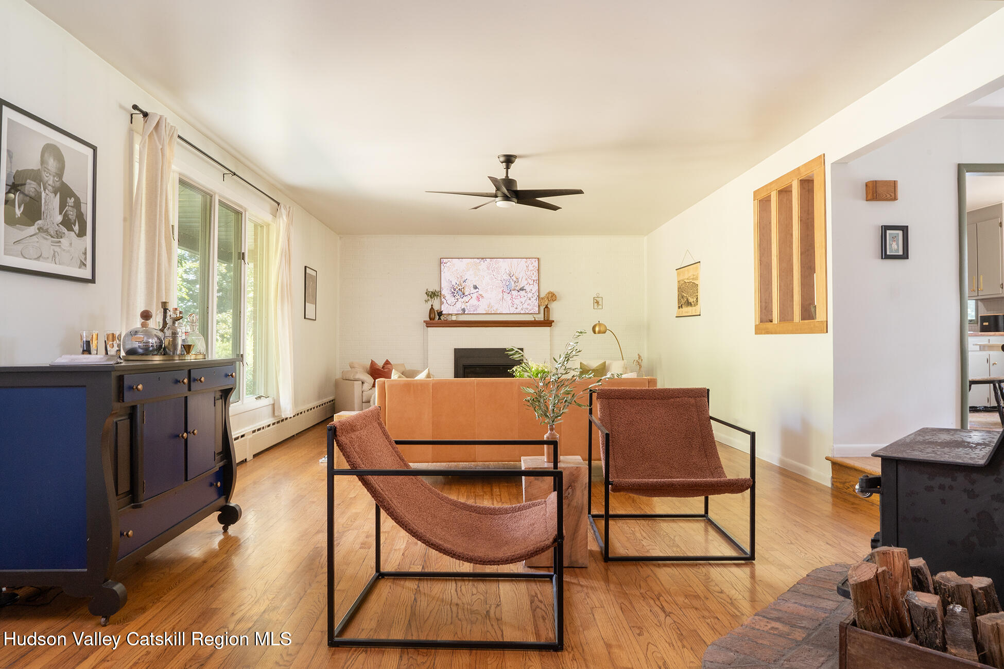 1002 Cairo Junction Road Catskill, NY 12414 - Photo 4 of 20 a living room with furniture a dining table and with wooden floor
