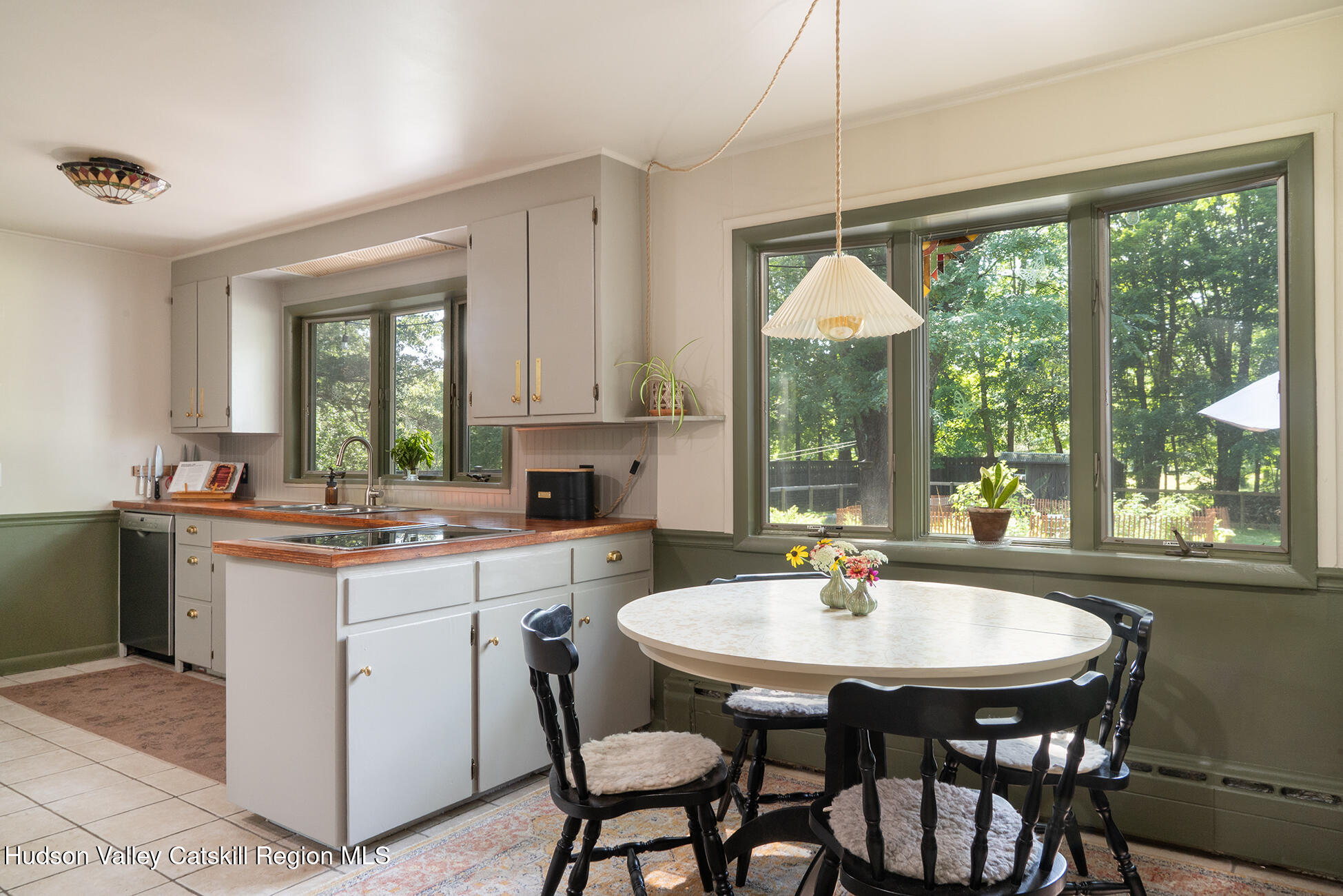 1002 Cairo Junction Road Catskill, NY 12414 - Photo 6 of 20 a kitchen with a table chairs sink and cabinets