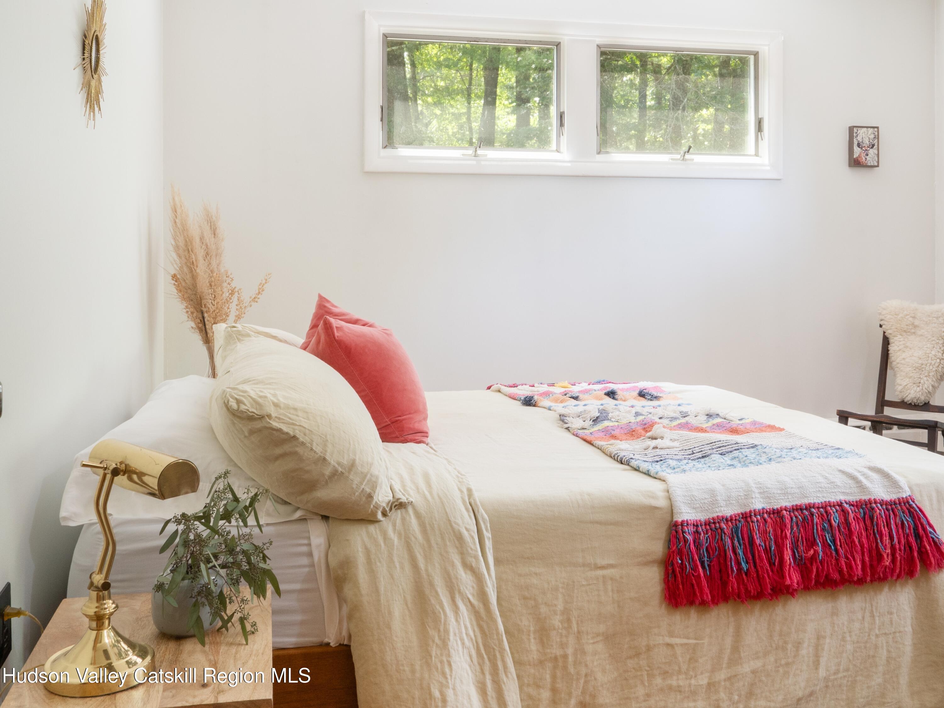 1002 Cairo Junction Road Catskill, NY 12414 - Photo 8 of 20 a bedroom with a bed and a window