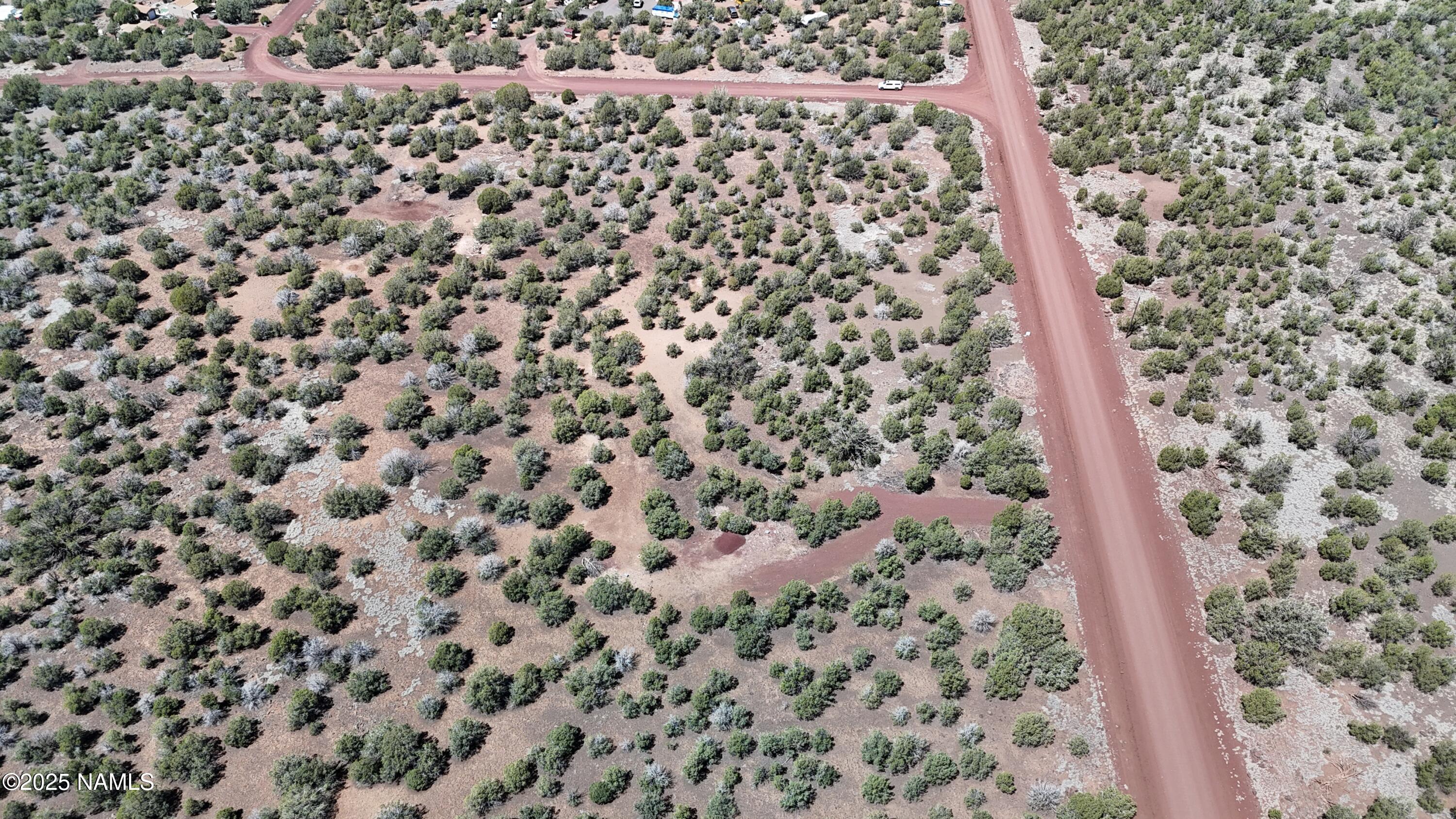 3288-3236 Cumberland Road Ash Fork, AZ 86320 - Photo 15 of 18 a bathroom with a shower curtain